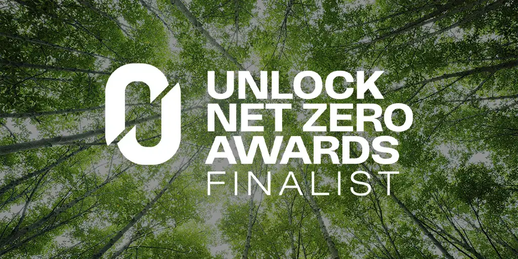 Unlock Net Zero Awards Finalist announcement graphic with forest canopy background highlighting sustainability and environmental achievement recognition.