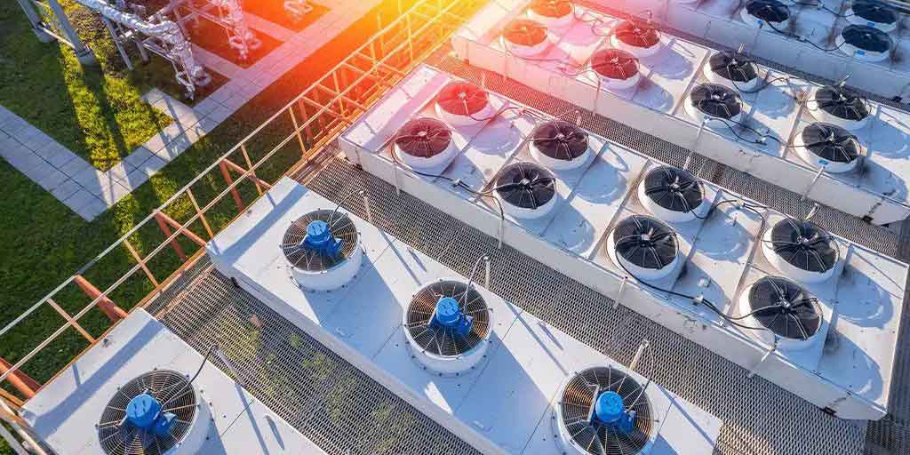 Large industrial HVAC cooling units installed outdoors for air conditioning system design